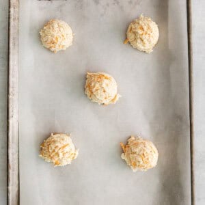 a baking sheet with a tray of cookies on it.