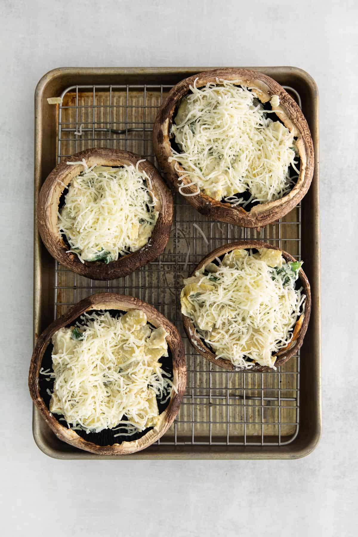 Stuffed mushrooms topped with mozzarella.