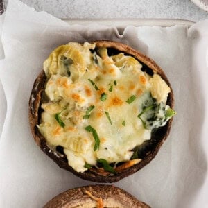 Stuffed mushrooms on a parchment paper.