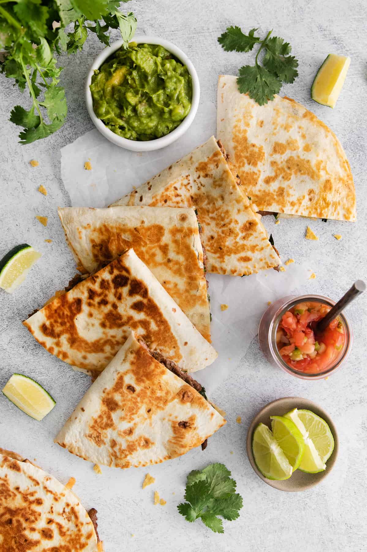 Sliced steak quesadilla on counter.