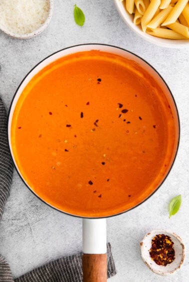tomato soup in a pan on a white background.