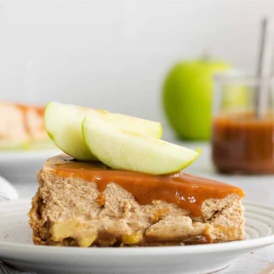 a slice of caramel apple cheesecake on a plate.