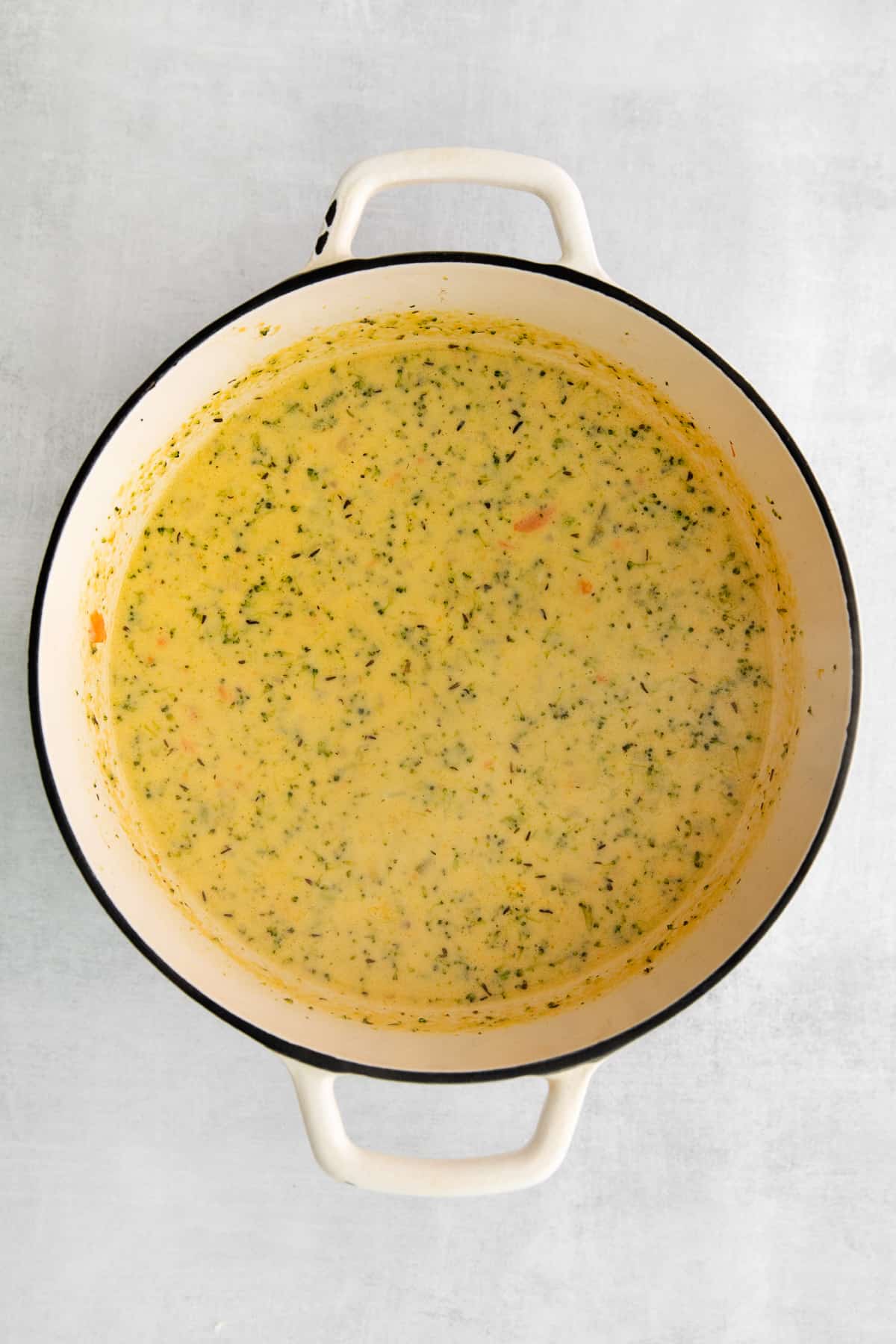 Broccoli potato cheese soup in a pot. 