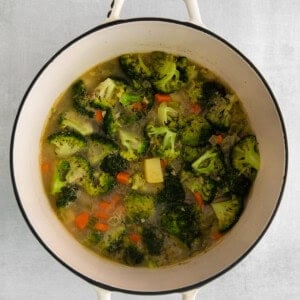 Simmering all the vegetables together in a pot.