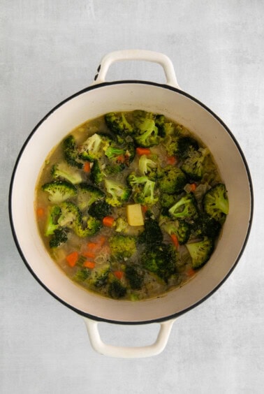 Simmering all the vegetables together in a pot.