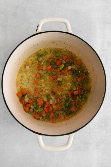 Browning garlic in the dutch oven.