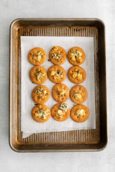ritz crackers on baking sheet.