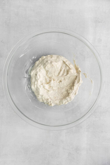 a bowl filled with white mashed potatoes.