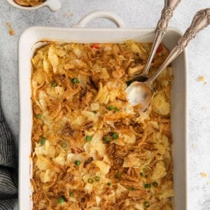 a casserole dish with a spoon and a fork.