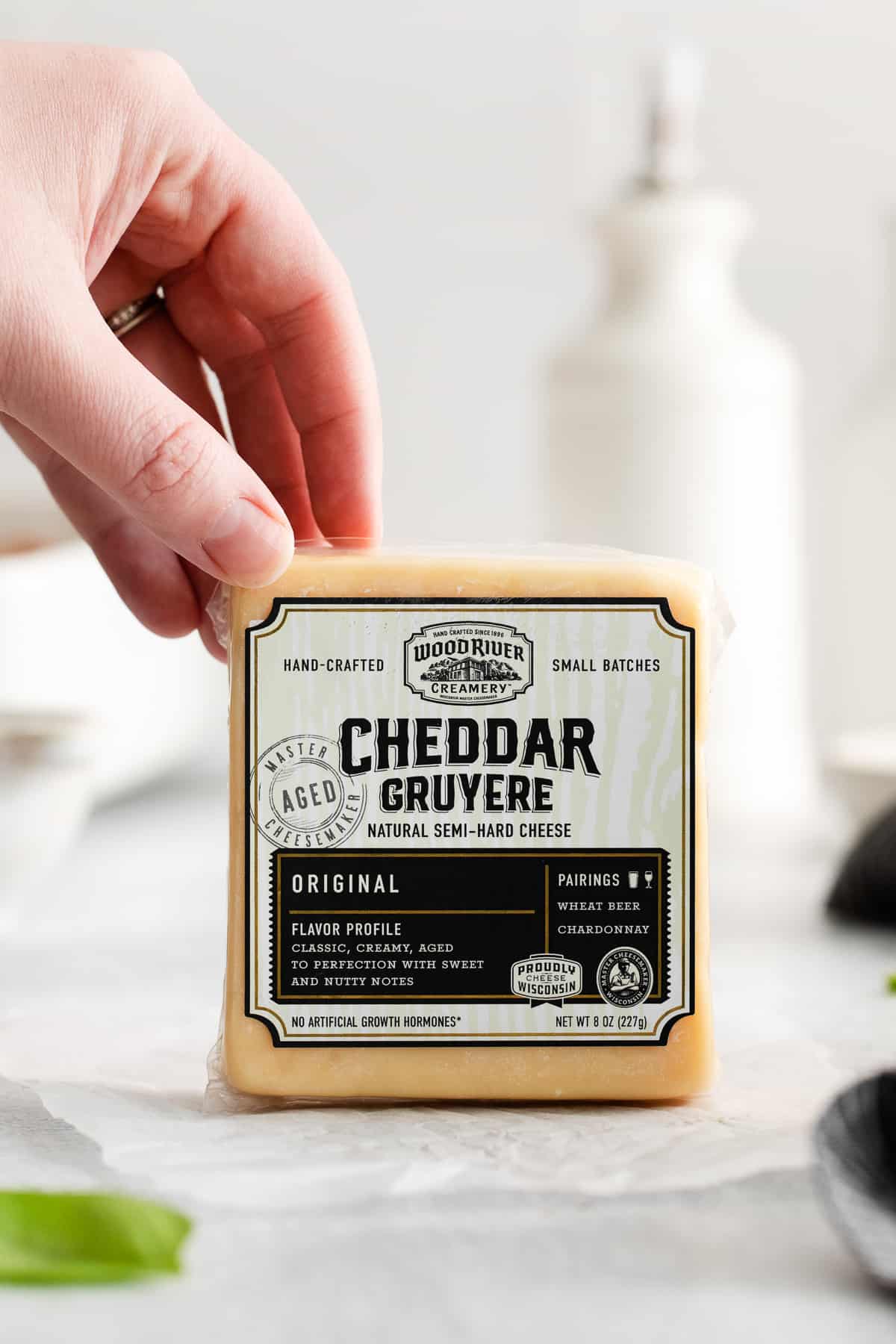 Block of cheddar gruyere cheese.