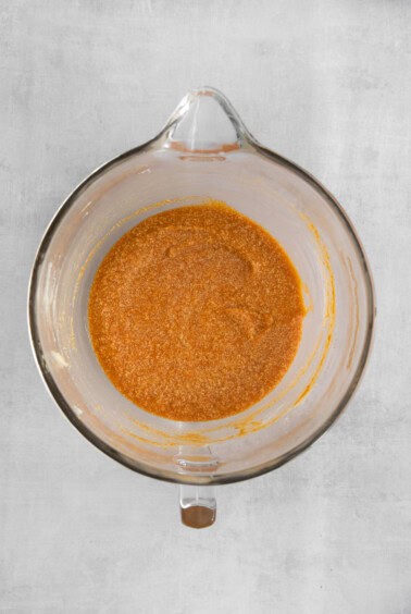 a glass bowl filled with a red sauce.