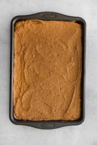a square of chocolate cake in a baking pan.
