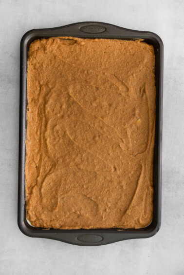 a square of chocolate cake in a baking pan.