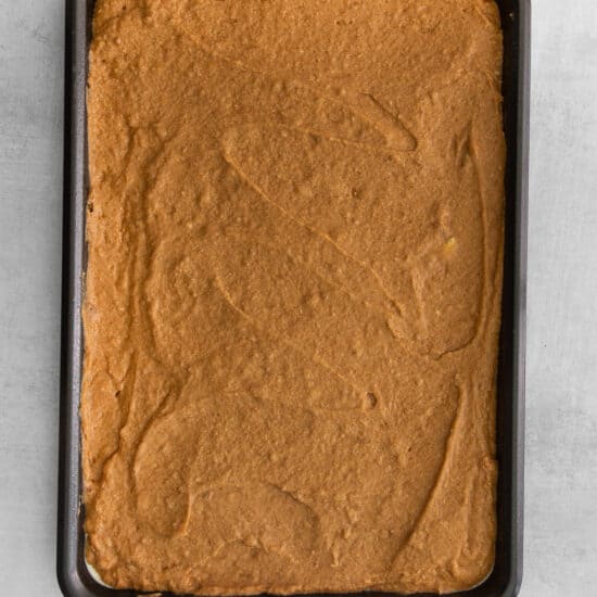 a square of chocolate cake in a baking pan.