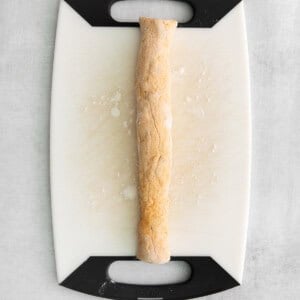 gnocchi log on cutting board.