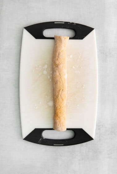 gnocchi log on cutting board.