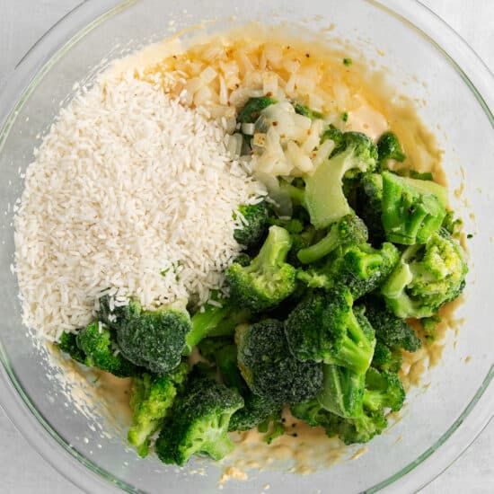 a bowl with broccoli and rice in it.
