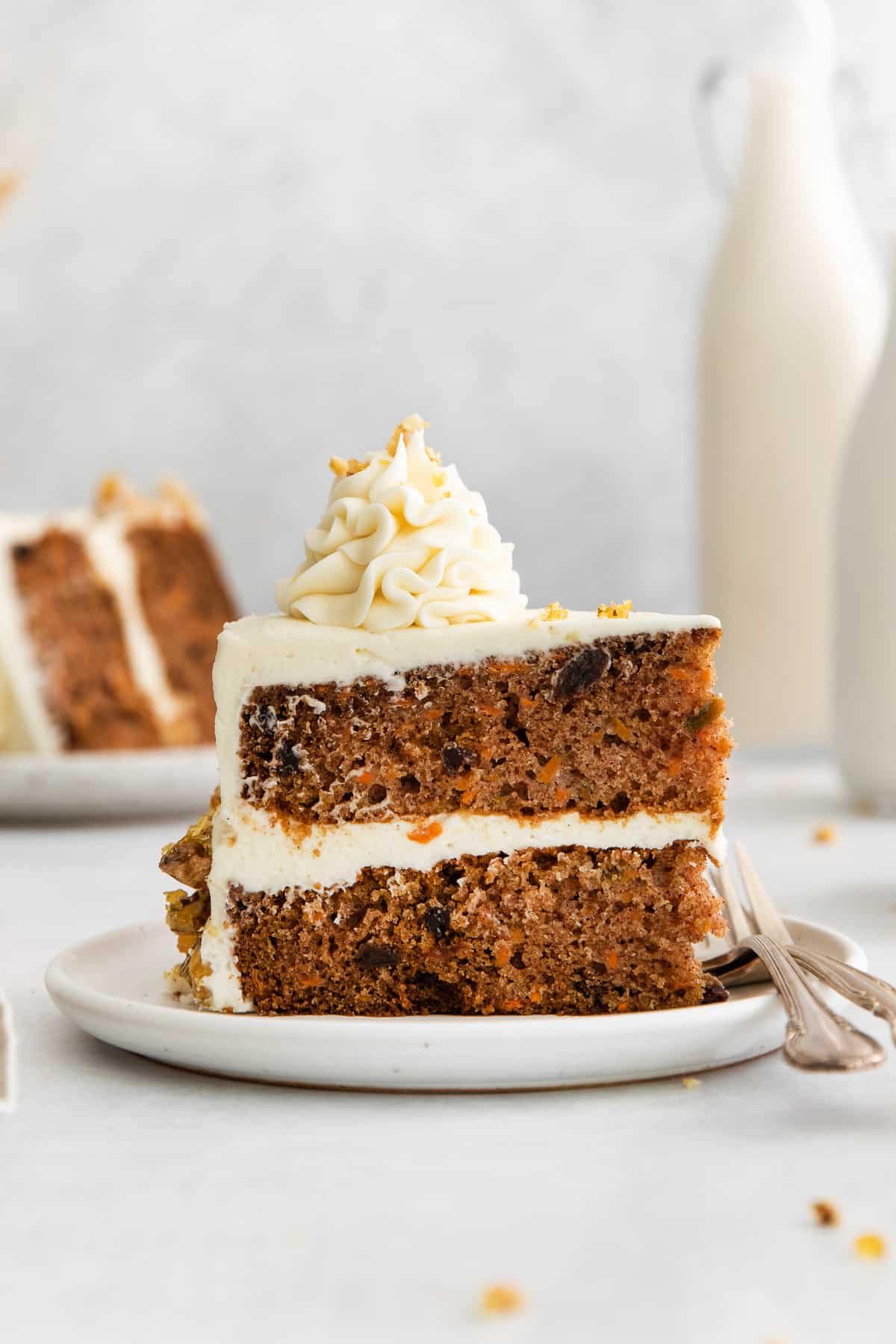 Slice of carrot cake on a plate.