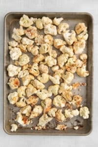 roasted cauliflower on a baking sheet.