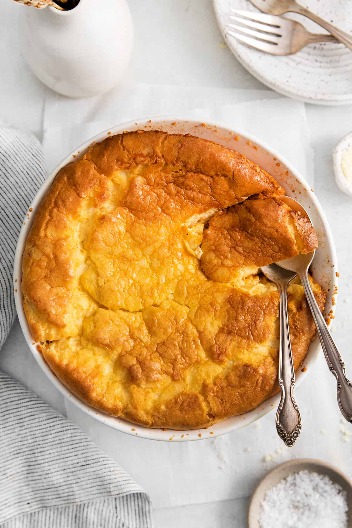 Cheese souffle in a round casserole dish.