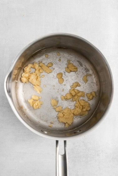 a frying pan with a piece of food in it.