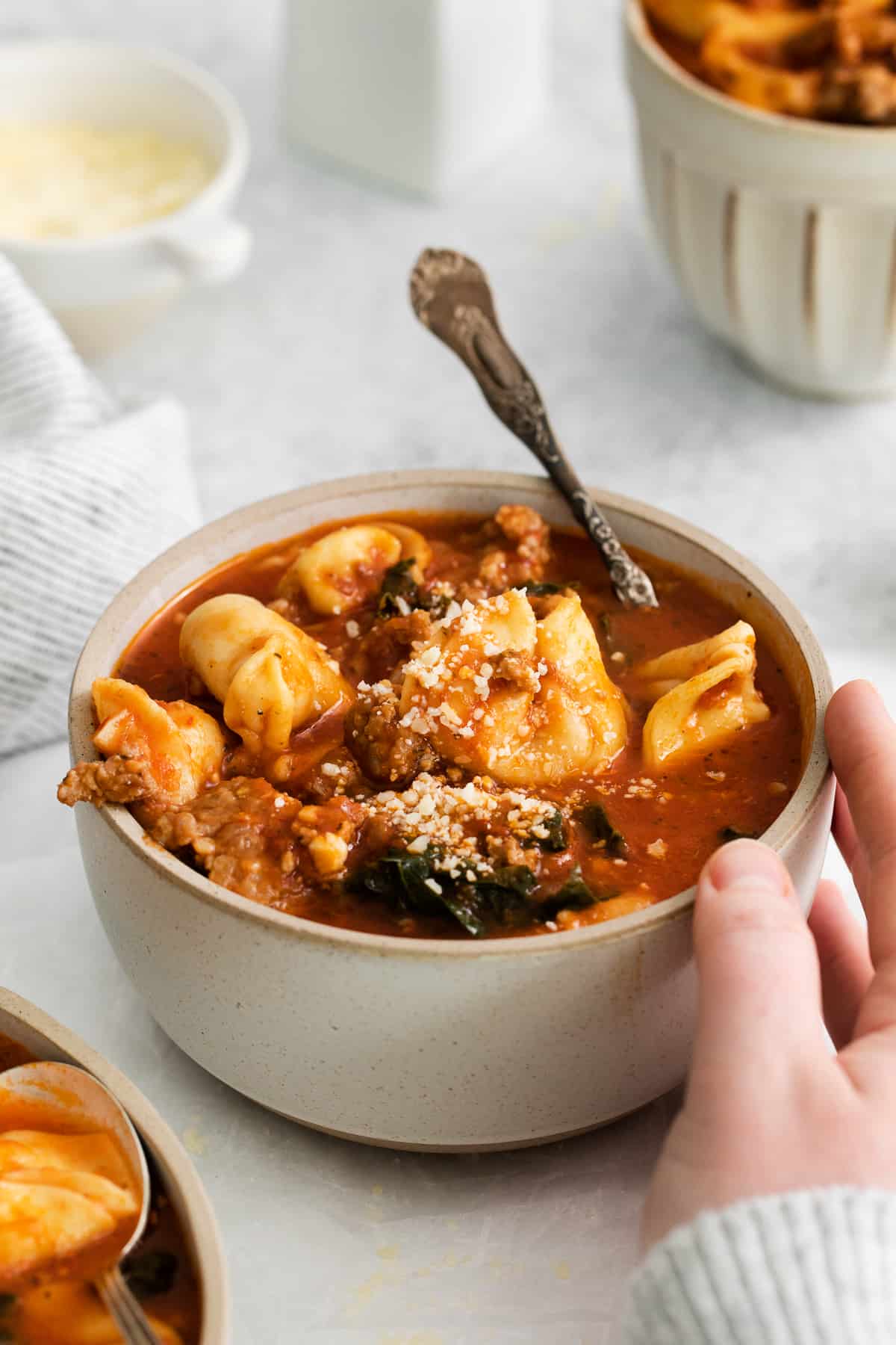 Cheese tortellini soup in a bowl.