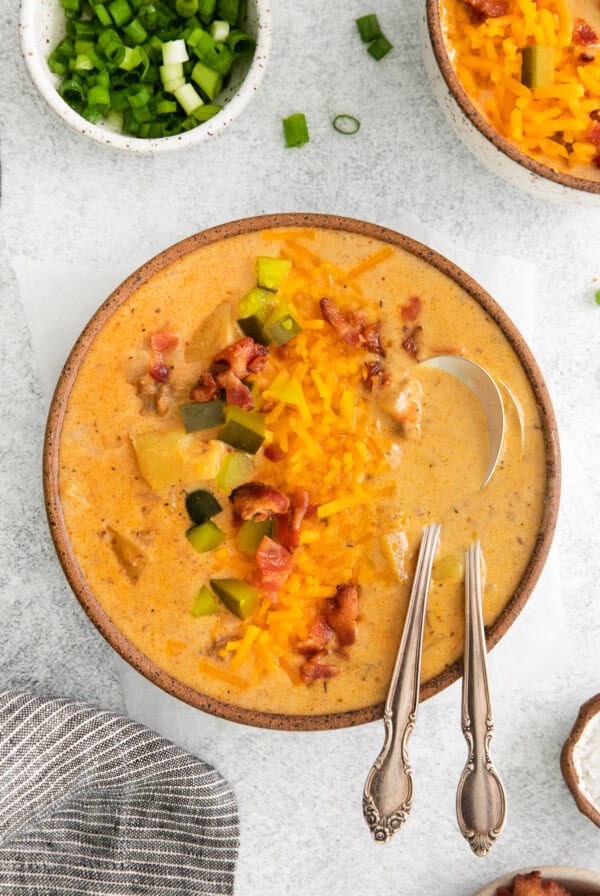 A cheesy soup packed with bacon and cheese, resembling a mouthwatering cheeseburger.