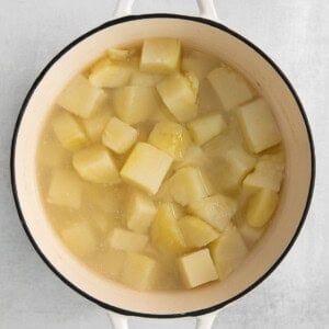 potatoes in a pot on a white background.