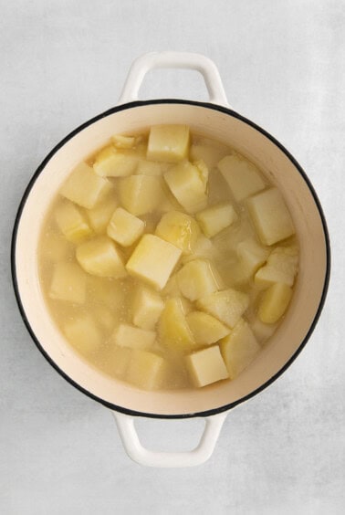 potatoes in a pot on a white background.