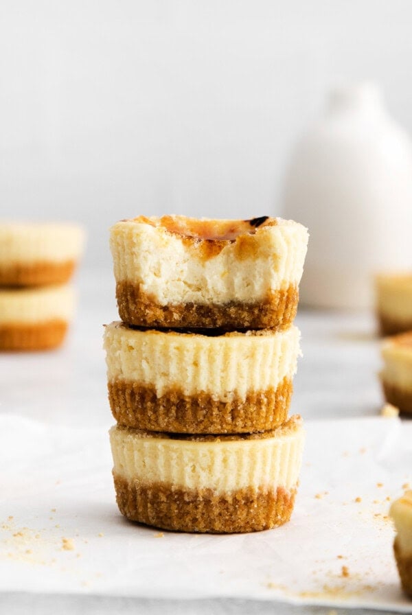 Mini creme brûlée cheesecake on a plate.