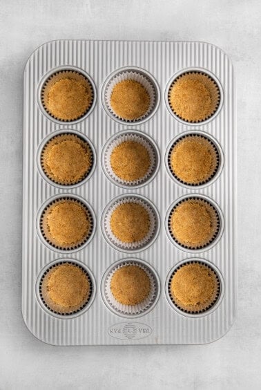 The crust in the bottom of a mini muffin pan.