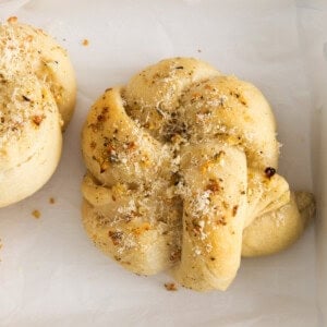 Parmesan garlic knots in a pan.