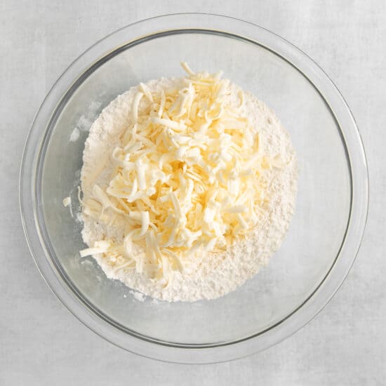 grated butter in flour.