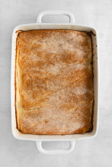 a white baking dish with a pie in it.