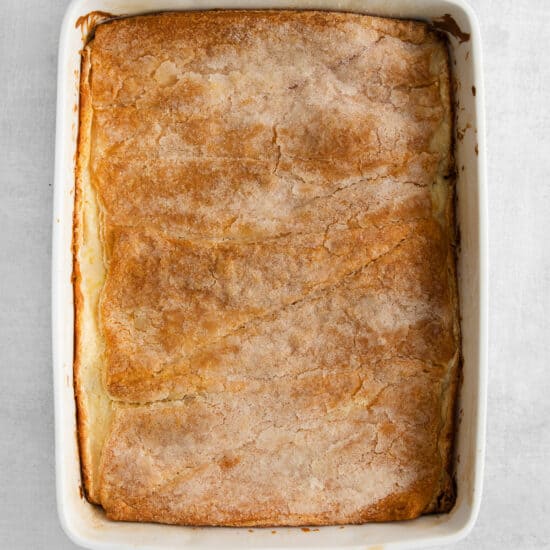 a white baking dish with a pie in it.