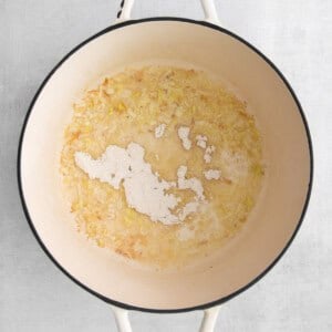 a pot filled with a mixture of flour and water on a white background.