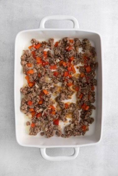 veggies and sausage in casserole dish,.