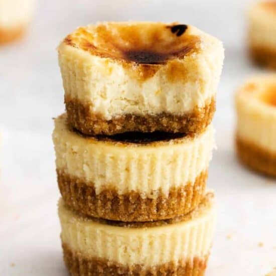 A stack of creme brulee cheesecakes.