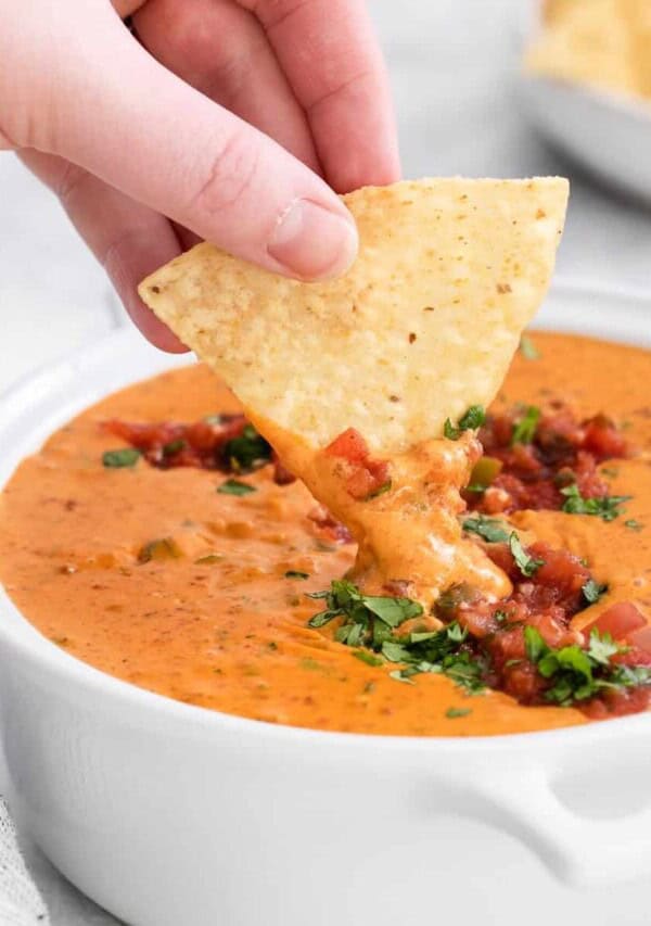 dipping chip into velveeta.