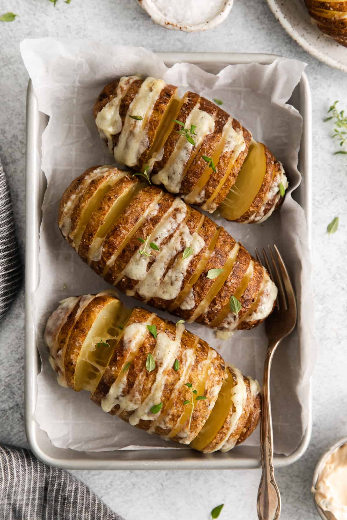 Air fryer hasselback potatoes on a plate.