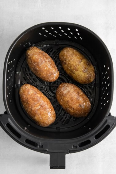 four fried potatoes in an air fryer.
