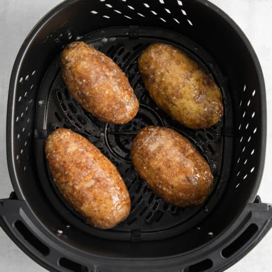 four fried potatoes in an air fryer.