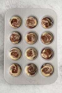 chocolate swirl cupcakes in a muffin tin.