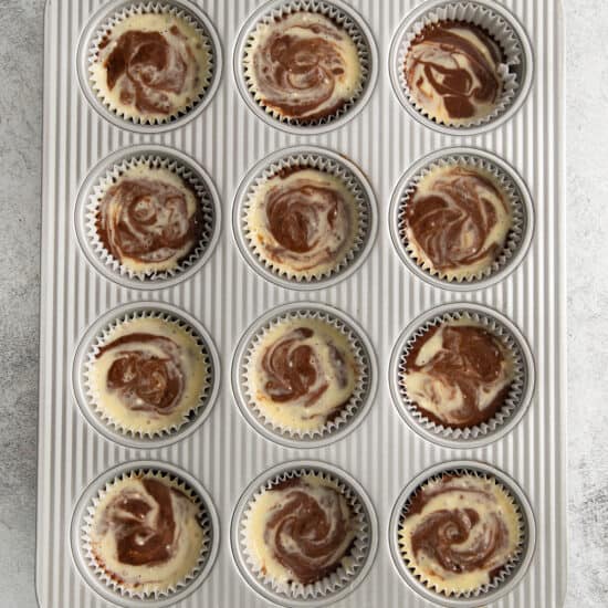 chocolate swirl cupcakes in a muffin tin.