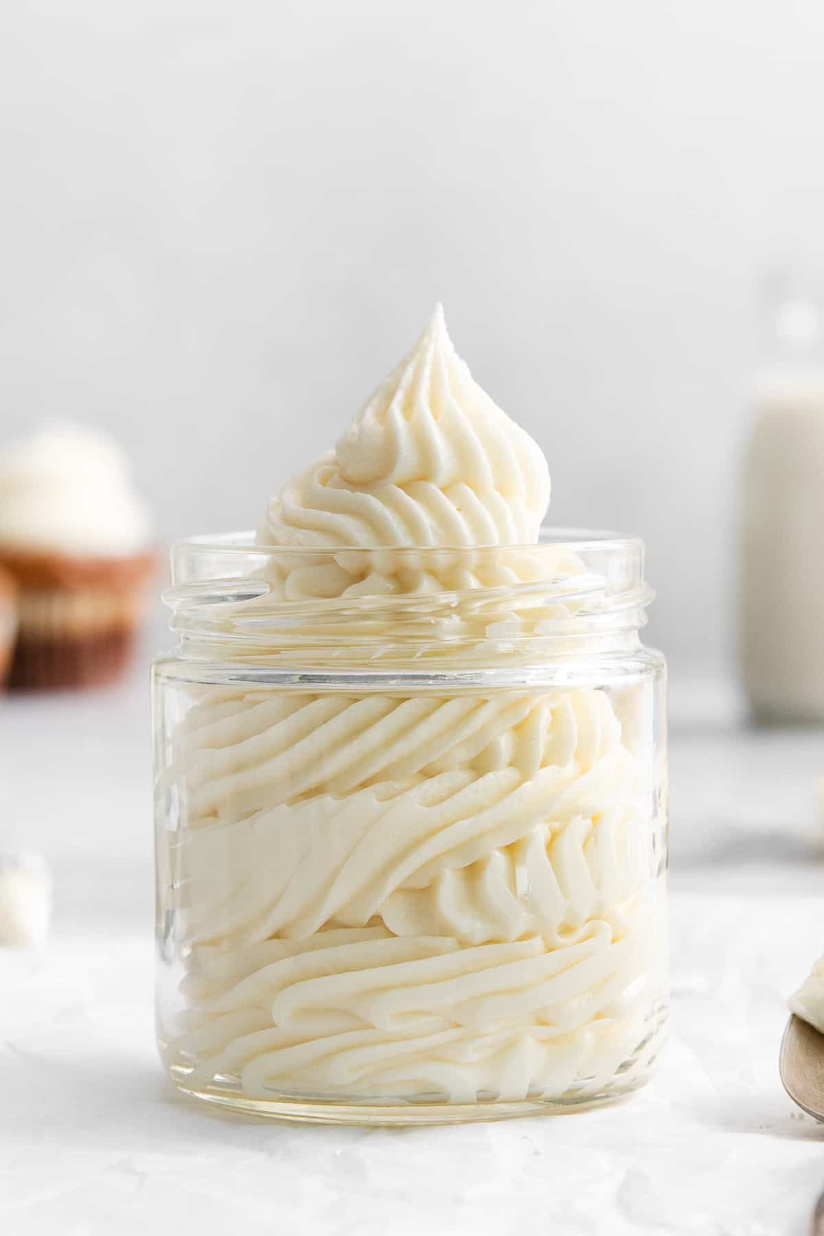 Cream cheese buttercream frosting in a jar.