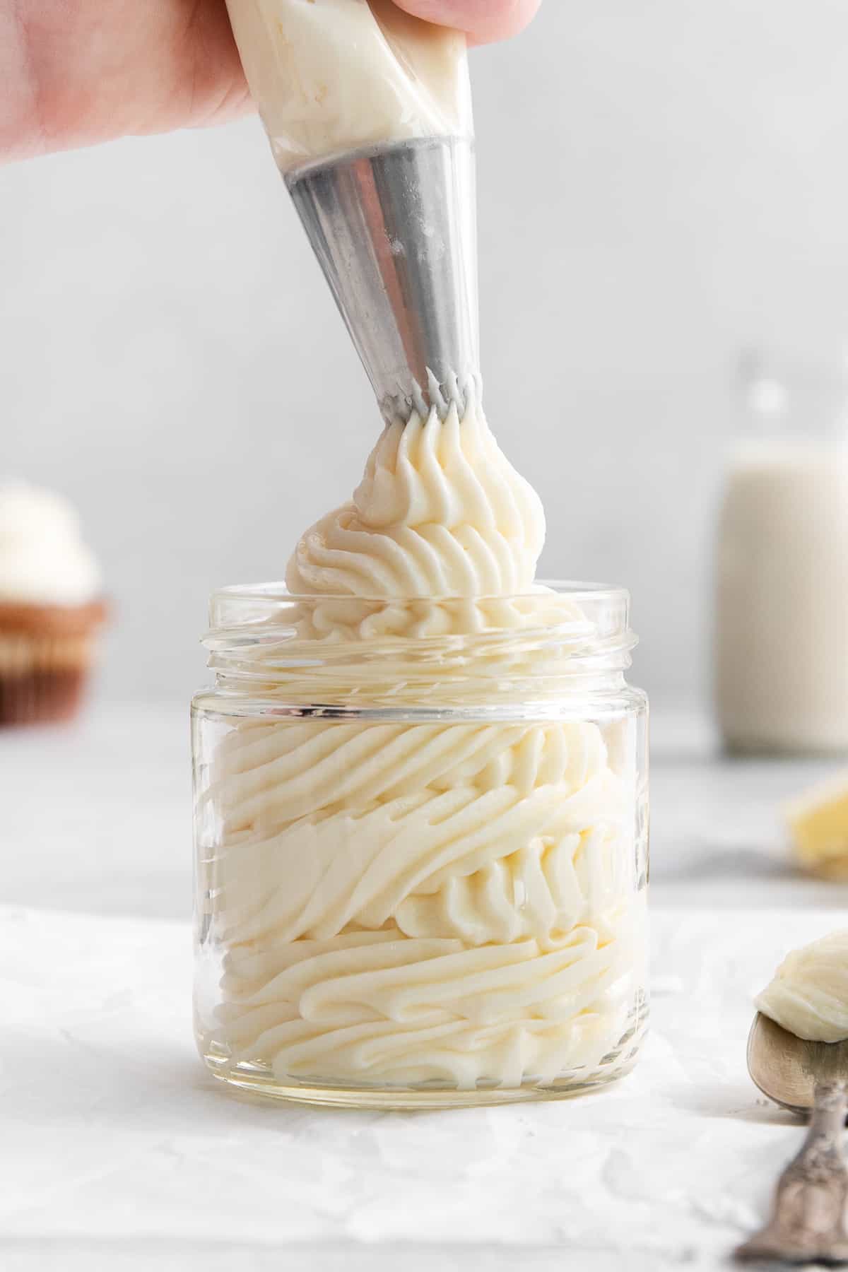 Cream cheese buttercream frosting in a jar.