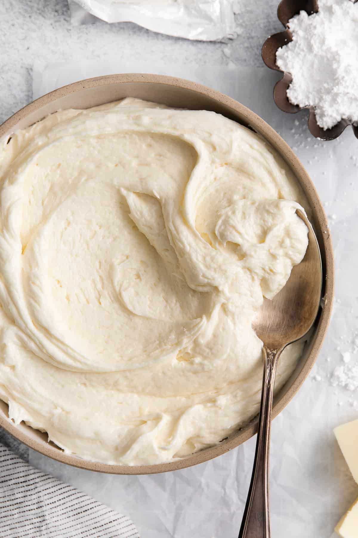 Cream cheese buttercream frosting in a bowl.