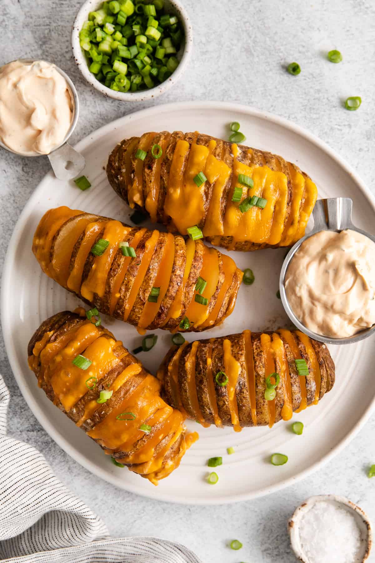 Hasselback potatoes on a plate.