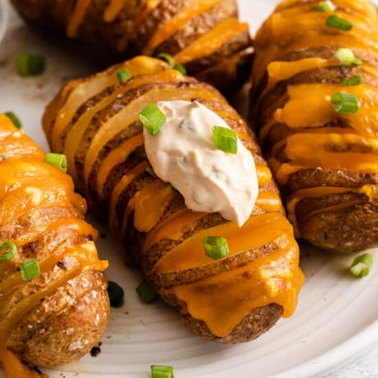 cheesy potato rolls topped with sour cream and green onions.