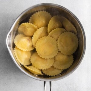 cooked ravioli in pot.